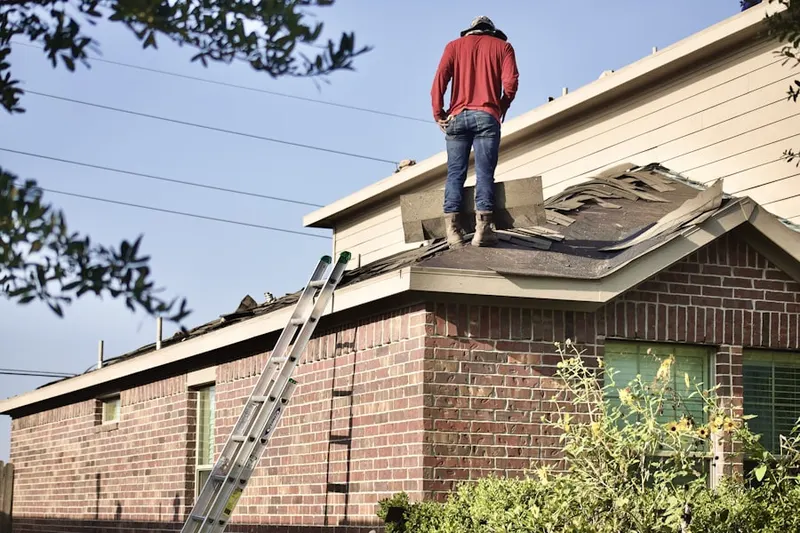 Professional roofer working on a residential roof in Jarrettsville